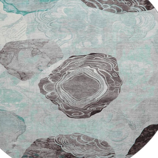 HomeRoots 8' Teal Charcoal and Ivory Geometric Round Rug - Washable, UV-Protected, Stylish for Any Space 697209