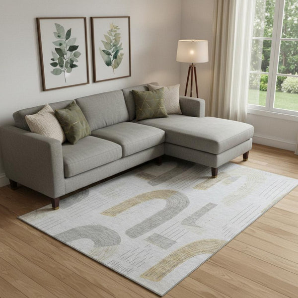 HomeRoots 10' X 14' Washable Geometric Area Rug - Silver, Gold & Gray with UV Protection for High-Traffic Spaces 697554