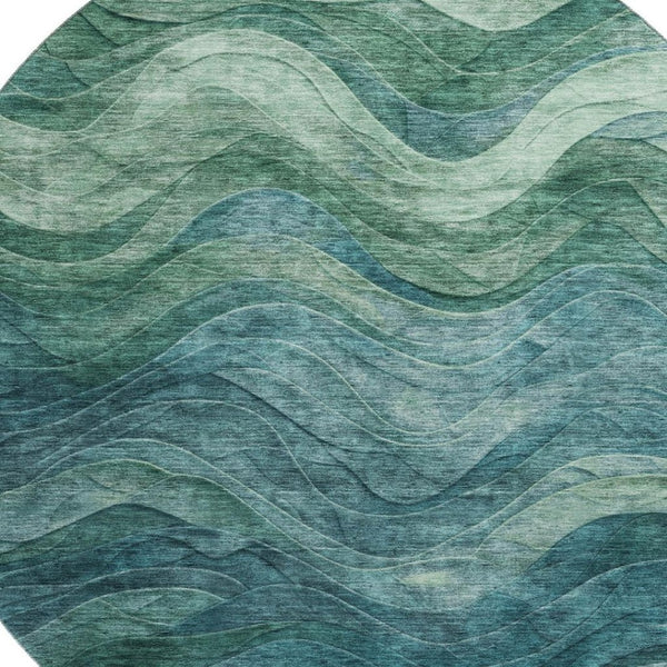 HomeRoots 8' Teal and Green Abstract Round Rug - Washable, UV-Protected, Durable Design for Modern Spaces 697611