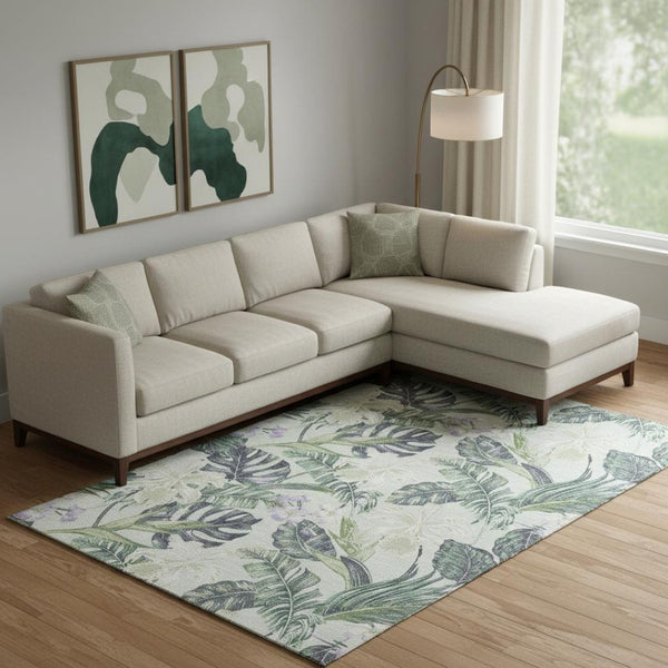 HomeRoots 9' X 12' Floral Area Rug in Artichoke Green, Lavender & Ivory with Washable, UV-Protected Design 697817