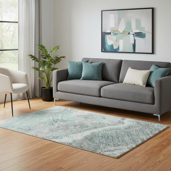 HomeRoots 5' X 8' Teal Gray Silver Abstract Area Rug - Washable, UV Protected, Durable, Modern Design for Homes 697868