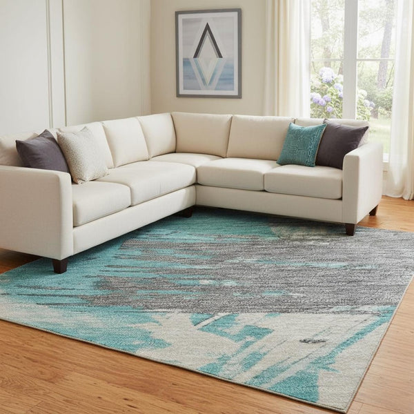 HomeRoots 8' X 10' Teal Beige Ivory Abstract Area Rug - Washable, UV Protected, Durable for Active Homes 697924