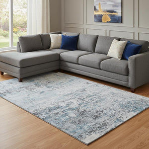 HomeRoots 8' X 10' Sky Blue Ivory Gray Abstract Washable Area Rug - Soft, Durable, Stain Resistant & UV Protected 699170