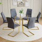 English Elm A Modern Minimalist Style Round Transparent Tempered Glass Table With Gold Metal Legs, Paired With 6 Modern Pu Leather High-Back Dining Chairs Bring A Luxurious Experience.