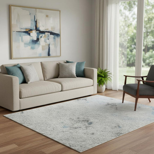 HomeRoots 5' X 8' Sky Blue Ivory Gray Abstract Area Rug - Washable, UV-Protected, Kid & Pet Friendly Design 700231