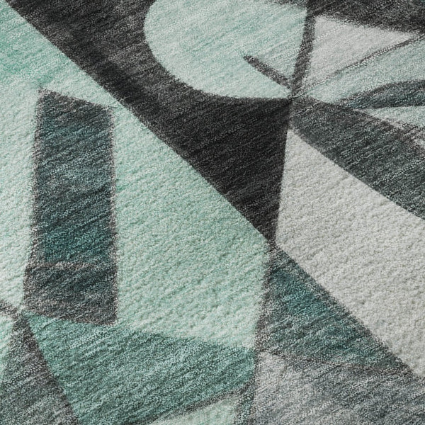HomeRoots 8' Modern Teal, Black & Ivory Abstract Washable Round Rug with UV Protection for High-Traffic Areas 700424
