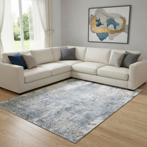 HomeRoots 8' X 10' Blue and Ivory Abstract Washable Area Rug – Stylish UV-Protected Design for High Traffic Spaces 700683