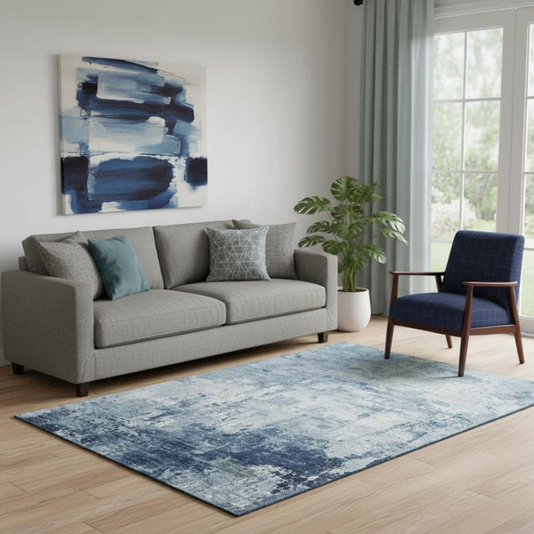 HomeRoots 5' X 8' Blue And Ivory Abstract Washable Area Rug - Durable, UV-Protected, Non-Slip for High Traffic Spaces 700705