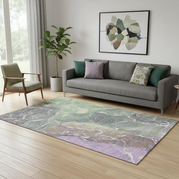 HomeRoots 5' X 8' Modern Abstract Washable Area Rug in Green, Purple & Gray with UV Protection & Durability 701209