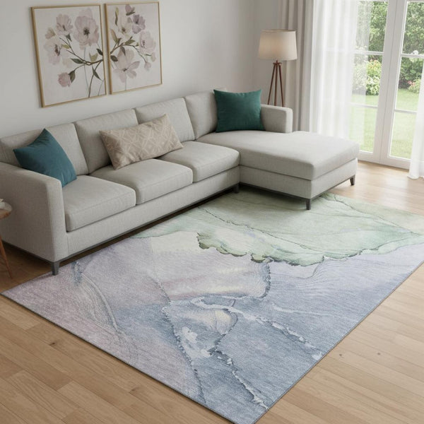 HomeRoots 9' X 12' Abstract Area Rug in Artichoke Green, Lavender & Ivory - Washable, UV Protected & Durable 701262