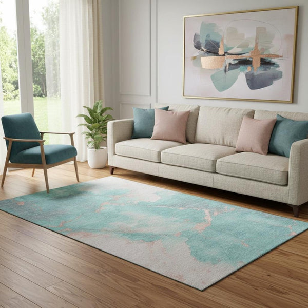 HomeRoots 5' X 8' Teal and Peach Abstract Area Rug - Washable, UV Protected, Stylish & Functional for Homes 701499