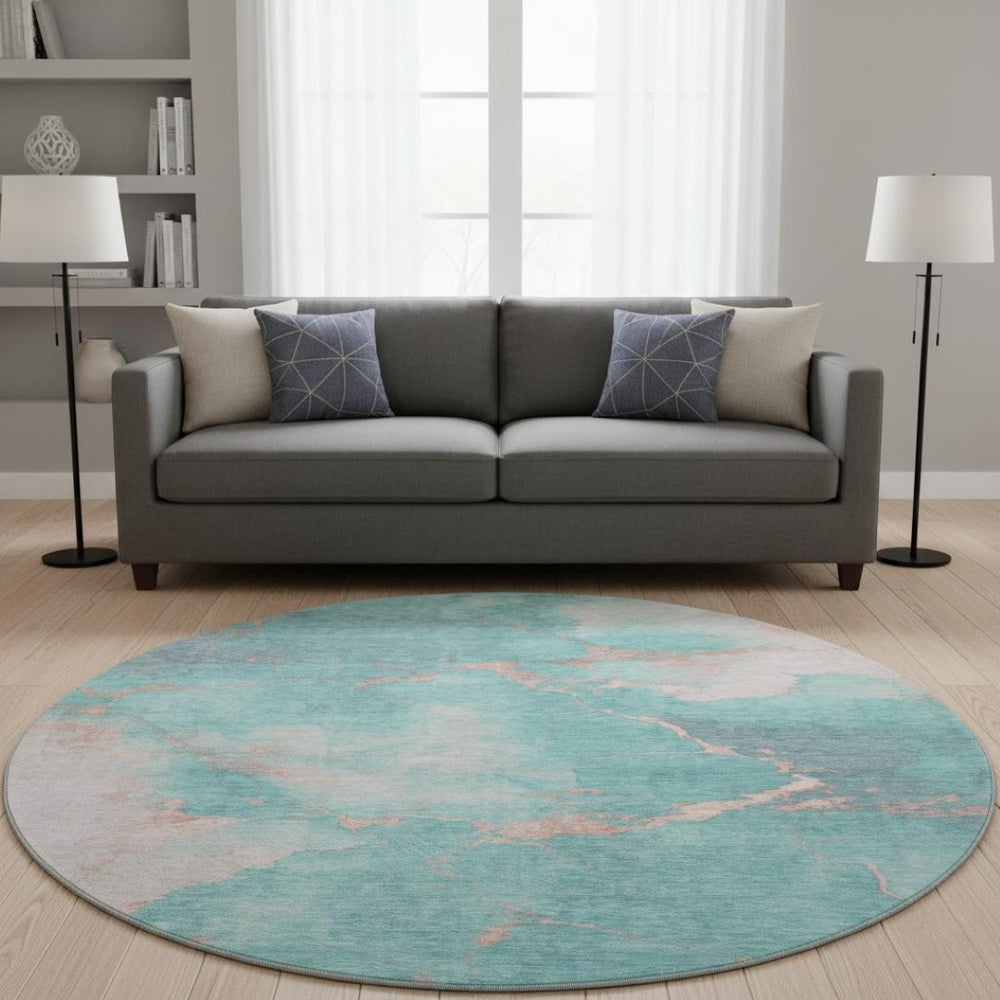 HomeRoots 8' Teal and Peach Abstract Washable Round Rug - Durable, UV-Protected, Perfect for High-Traffic Spaces! 701500