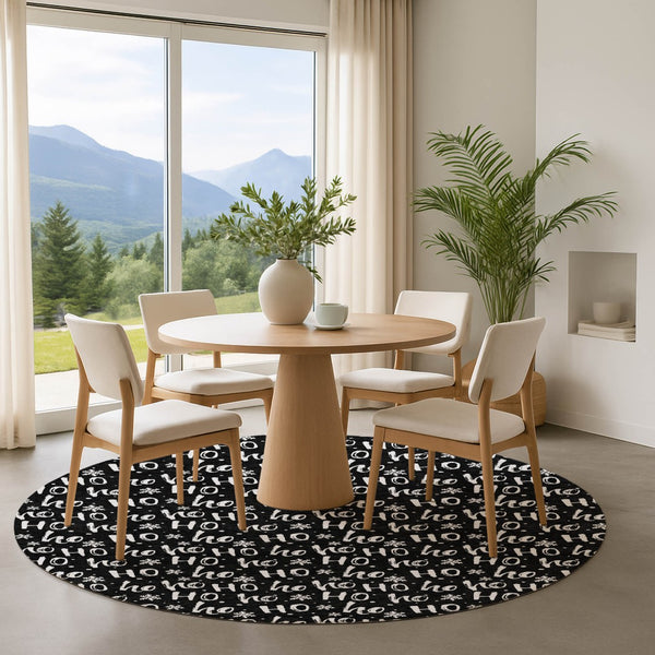HomeRoots 8' Black and Ivory Abstract Geometric Round Rug – Washable, Durable, UV-Protected for Modern Living 701789