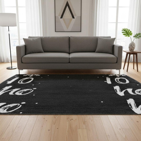HomeRoots 8' Black and Ivory Abstract Geometric Round Rug – Washable, Durable, UV-Protected for Modern Living 701789