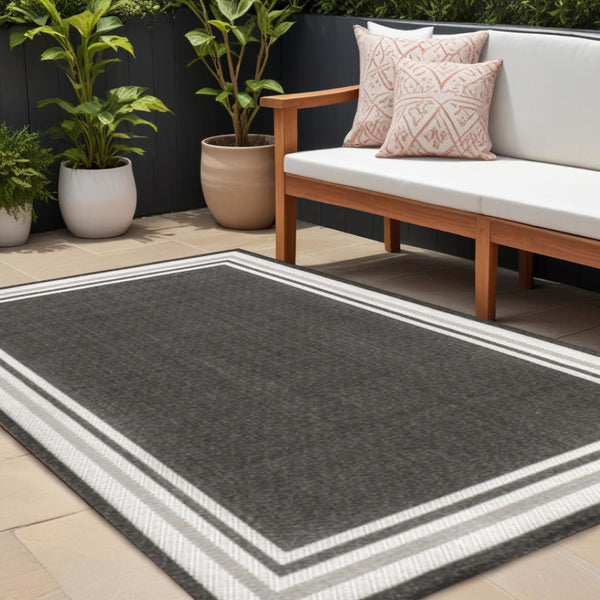 HomeRoots 8' X 10' Black and Cream Striped Area Rug – Stylish, Durable, Easy-Care Indoor/Outdoor Decor Solution 702644