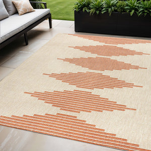 HomeRoots 5' X 8' Beige and Orange Abstract Area Rug - Stylish, Durable, Indoor/Outdoor Design for Any Space 702664