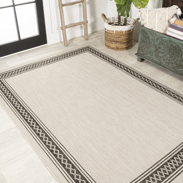 HomeRoots 8' X 10' Cream and Black Area Rug – Durable, Versatile Indoor/Outdoor Style for Any Space, Easy Care! 702923