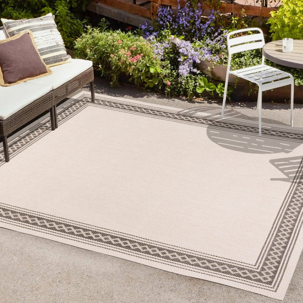HomeRoots 8' X 10' Cream and Black Area Rug – Durable, Versatile Indoor/Outdoor Style for Any Space, Easy Care! 702923