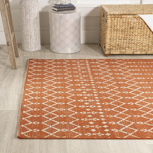 HomeRoots 9' X 12' Orange and Cream Trellis Area Rug - Durable Indoor/Outdoor Solution for Stylish Spaces 703059