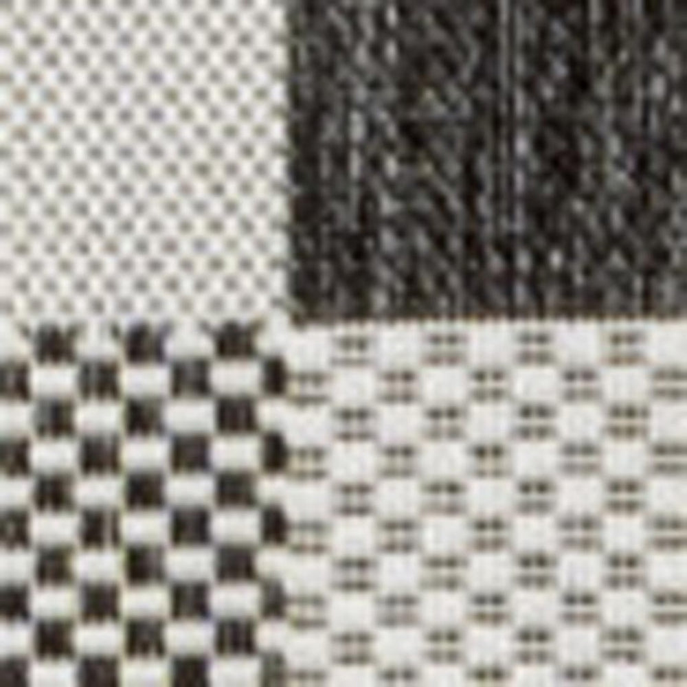 HomeRoots 5' Black and Cream Geometric Area Rug - Modern Indoor Outdoor Accent for Stylish Living Spaces 703574