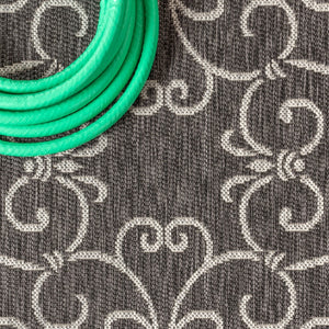 HomeRoots 5' Round Medallion Area Rug in Black and Gray - Durable Indoor/Outdoor Geometric Design for Any Space 704350