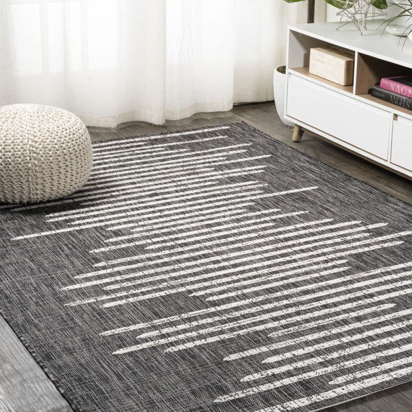 HomeRoots 10' Stylish Black and Ivory Striped Indoor Outdoor Area Rug - Durable, Versatile, Easy Care Design 704532