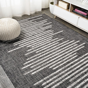 HomeRoots 10' Stylish Black and Ivory Striped Indoor Outdoor Area Rug - Durable, Versatile, Easy Care Design 704532