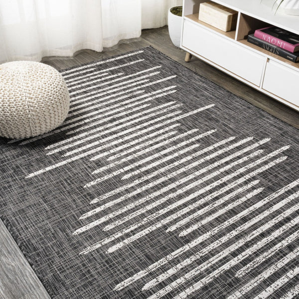 HomeRoots 10' Stylish Black and Ivory Striped Indoor Outdoor Area Rug - Durable, Versatile, Easy Care Design 704532