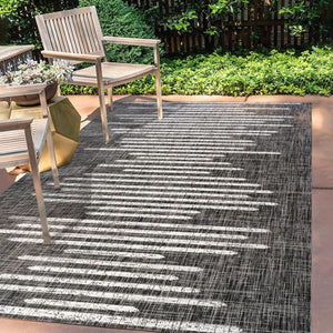 HomeRoots 10' Stylish Black and Ivory Striped Indoor Outdoor Area Rug - Durable, Versatile, Easy Care Design 704532