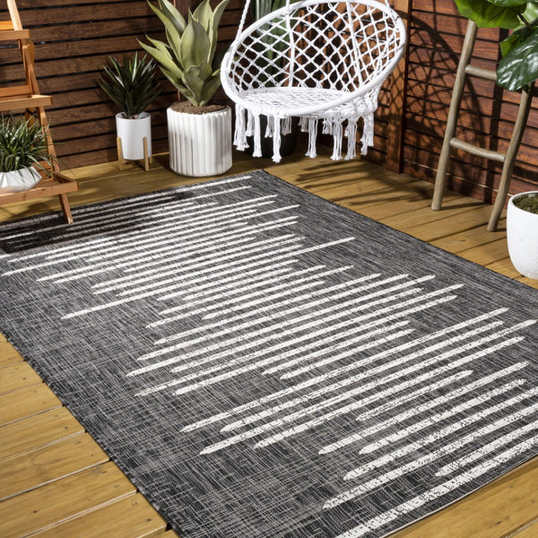 HomeRoots 10' Stylish Black and Ivory Striped Indoor Outdoor Area Rug - Durable, Versatile, Easy Care Design 704532