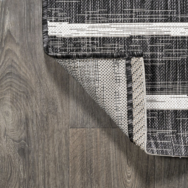 HomeRoots 6' Modern Black and Ivory Striped Round Rug - Weather-Resistant, Easy-Clean Indoor/Outdoor Accent 704572