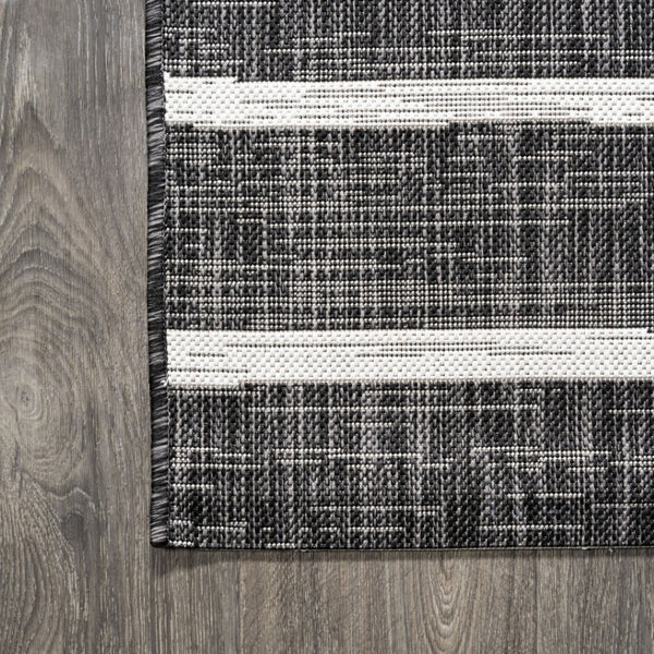 HomeRoots 8' Black and Ivory Striped Area Rug – Durable Indoor/Outdoor Round Rug for Stylish Spaces & Easy Care 704574