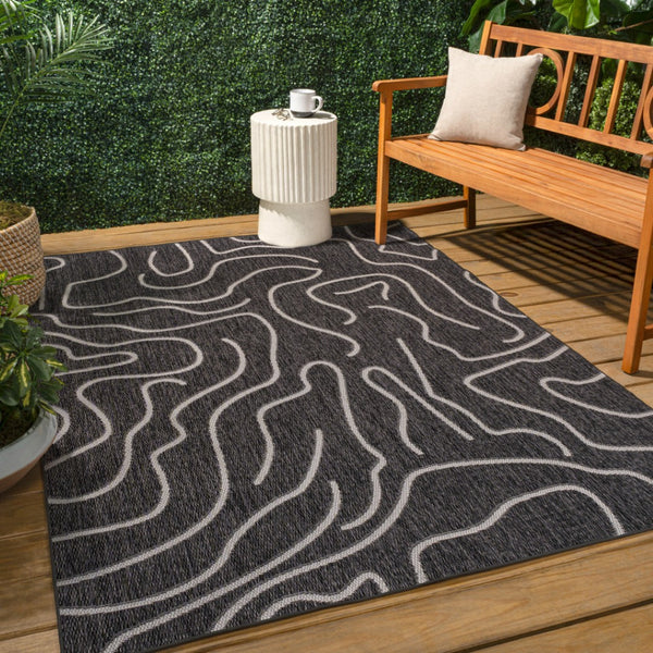 HomeRoots 5' X 8' Black and Cream Abstract Area Rug - Stylish Indoor & Outdoor Modern Accent for Any Space 704688
