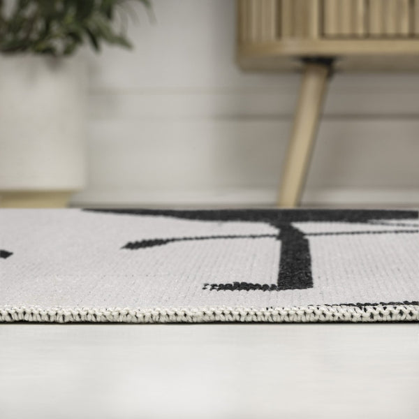 HomeRoots 8' White and Black Animal Print Runner Rug – Durable, Stylish Indoor/Outdoor Accent for Any Space 704715