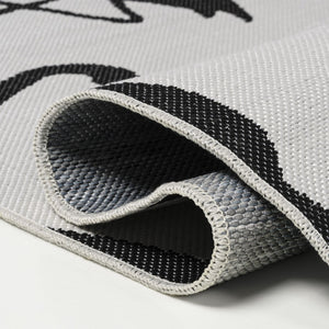 HomeRoots 8' White and Black Animal Print Runner Rug – Durable, Stylish Indoor/Outdoor Accent for Any Space 704715