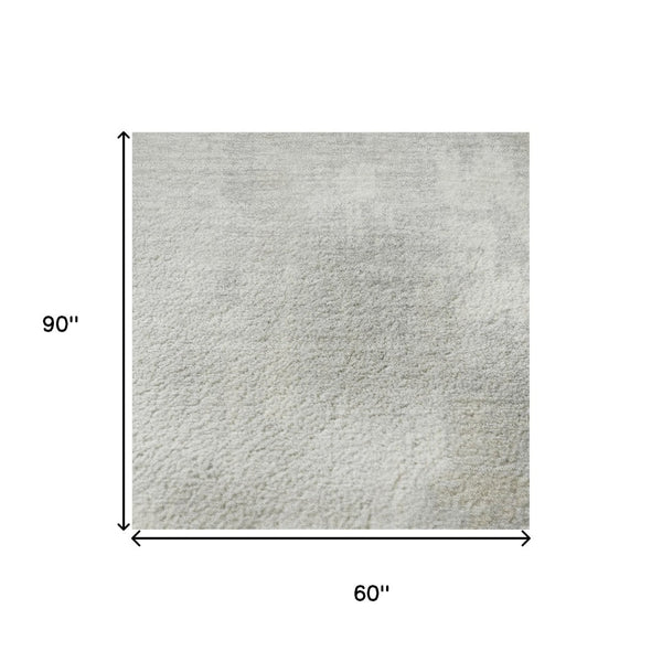HomeRoots 5' x 8' Ivory and Beige Abstract Area Rug – Washable, UV Protected, Durable for Homes with Kids & Pets 705391
