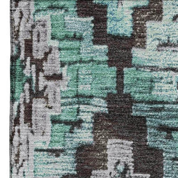 HomeRoots 9' X 12' Stylish Teal Charcoal Ivory Ikat Washable Area Rug with UV Protection for Easy Living 707124