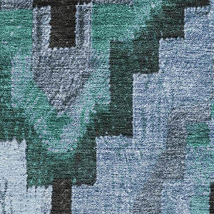 HomeRoots 8' Teal And Charcoal Ikat Washable Round Rug with UV Protection for Stylish, High-Traffic Spaces 707242