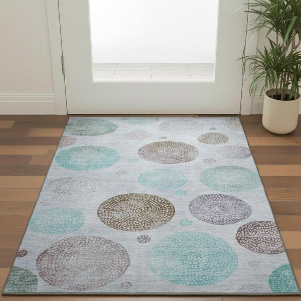 HomeRoots 5' X 8' Geometric Area Rug in Blue, Brown & Teal - Washable, UV Protected & Stain-Resistant Design 707367