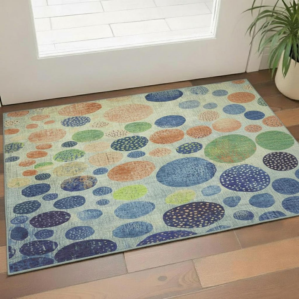HomeRoots 5' X 8' Modern Geometric Area Rug in Navy, Green & Peach - Washable, UV Protected, Non-Slip Design 707445