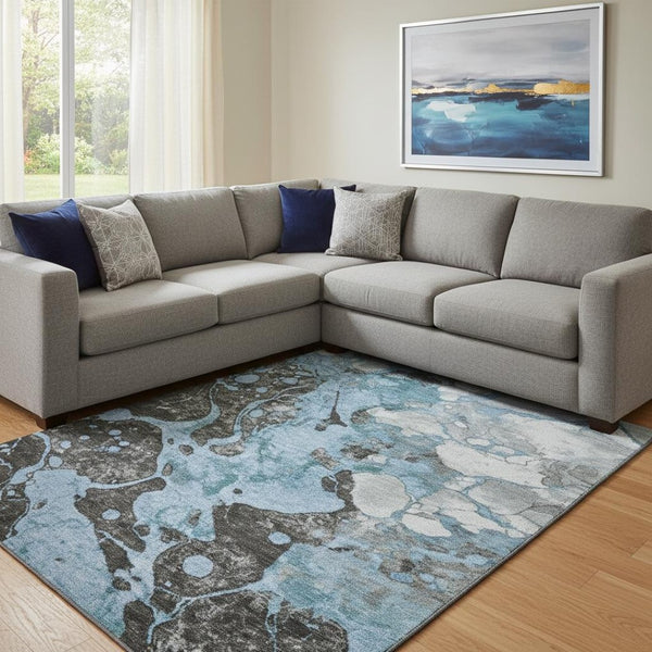 HomeRoots 9' X 12' Washable Blue Gray Ivory Abstract Area Rug with UV Protection for Modern Living Spaces 707766