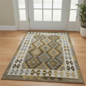 HomeRoots 5' X 8' Brown And Ivory Tribal Area Rug - Washable, UV Protected, Stain Resistant, Pet Friendly Design 707925