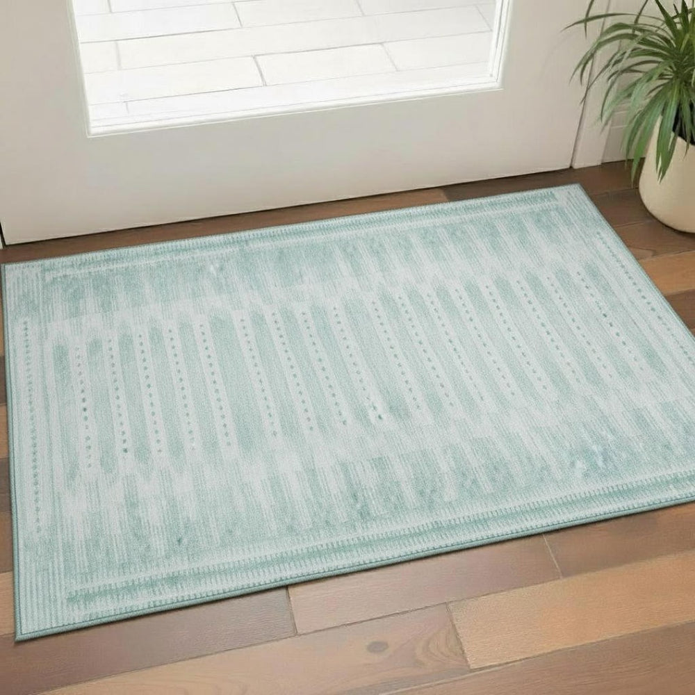 HomeRoots 5' X 8' Turquoise Aqua Geometric Area Rug - UV Protected, Washable & Durable for High-Traffic Spaces 708045