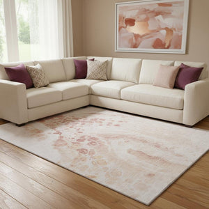HomeRoots 9' X 12' Salmon and Ivory Modern Abstract Washable Area Rug with UV Protection & Stain Resistance 708570