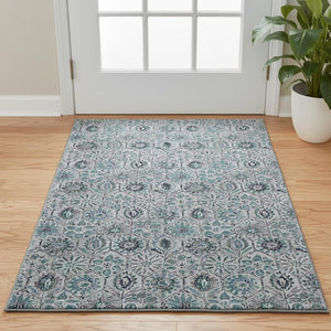 HomeRoots 5' X 8' Teal Gray Silver Floral Area Rug - Washable, UV Protected, Stain Resistant for High Traffic Rooms 708675