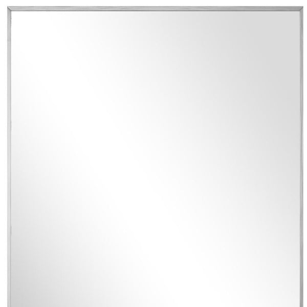 HomeRoots Silver Freestanding Ornate Framed Accent Mirror - Elegant Aluminum Design for Any Room Decor 708724