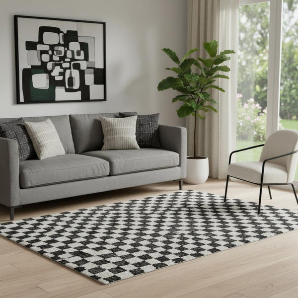 HomeRoots 8' Stylish Black and Ivory Geometric Round Rug - Washable, UV-Protected, Perfect for High-Traffic Areas 709369