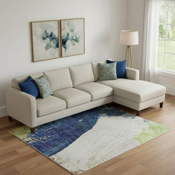 HomeRoots 10' X 14' Abstract Area Rug in Artichoke Green, Blue & Ivory - Washable, UV Protected & Stylish 709576