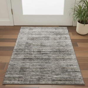HomeRoots 5' X 8' Elegant Taupe Brown and Ivory Striped Washable Area Rug with UV Protection for Homes 709758