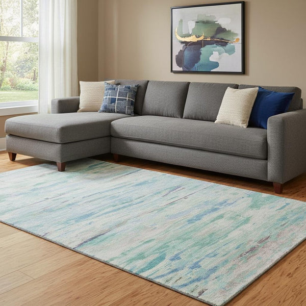 HomeRoots 9' X 12' Teal And Ivory Abstract Area Rug - Durable, Washable, UV-Protected, Ideal for Family Spaces 710153
